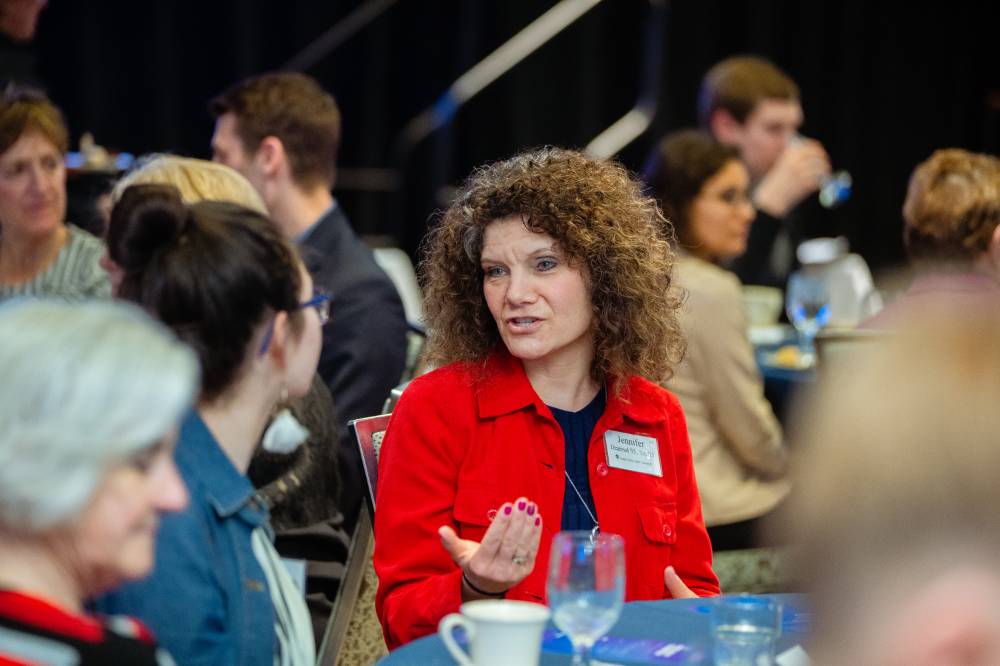 Donor in conversation with a student at Scholarship Dinner 2019